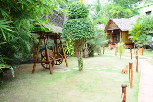 Wooden artefacts amidst greenery