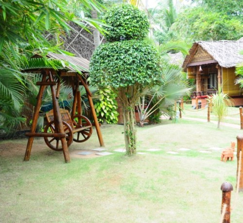 Wooden artefacts amidst greenery