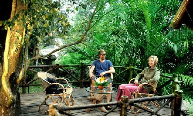 Guests relaxing in sit-out at the Bamboo Tree House Guests relaxing in sit-out at the Bamboo Tree House