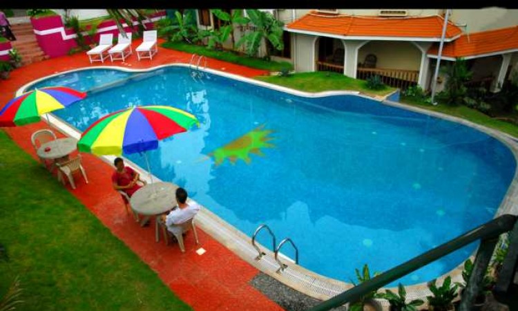 Guests relaxing by the pool Guests relaxing by the pool